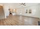 Open-concept living space with kitchen view and hardwood floors at 46 Lupin Dr, Smithfield, NC 27577