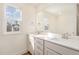Bright main bathroom features double vanity and large mirror at 46 Lupin Dr, Smithfield, NC 27577