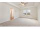 Spacious main bedroom with tray ceiling, fan, and large windows at 46 Lupin Dr, Smithfield, NC 27577