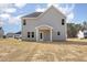 This home features a back patio, vinyl siding, a dark shingle roof, and an expansive yard at 46 Lupin Dr, Smithfield, NC 27577