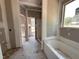New bathroom displaying a tub and natural light at 47 Royal Ave, Selma, NC 27576