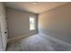 Comfortable bedroom with neutral walls, large window, and bright natural light at 47 Royal Ave, Selma, NC 27576
