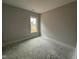 Bright bedroom with a window, ready for your personal touches and comfortable living at 47 Royal Ave, Selma, NC 27576