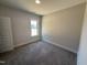 Neutral bedroom with carpet flooring, natural lighting, and spacious closet at 47 Royal Ave, Selma, NC 27576