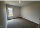 Cozy bedroom with carpet flooring, a window with natural light, and neutral walls at 47 Royal Ave, Selma, NC 27576
