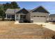 Charming single-Gathering home featuring a two-car garage and craftsman-style architectural details at 47 Royal Ave, Selma, NC 27576