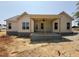 New construction showing an inviting back porch with ceiling fan perfect for outdoor relaxation at 47 Royal Ave, Selma, NC 27576