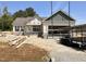 Under-construction single story home featuring light siding and a two car garage at 47 Royal Ave, Selma, NC 27576