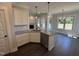 Kitchen island featuring a stainless steel dishwasher, granite countertops, undermount sink, and pendant lights at 47 Royal Ave, Selma, NC 27576