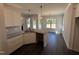 Modern kitchen with white cabinets, granite countertops, and dark hardwood flooring at 47 Royal Ave, Selma, NC 27576