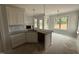 Bright kitchen featuring granite countertops, stainless steel sink, and pendant lighting at 47 Royal Ave, Selma, NC 27576
