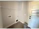 Functional laundry room with convenient shelving and utility connections at 47 Royal Ave, Selma, NC 27576