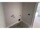 A basic laundry room area with connections ready for a washer and dryer at 47 Royal Ave, Selma, NC 27576