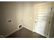 Functional laundry room with tile floors, ready for appliances and easy access to outside at 47 Royal Ave, Selma, NC 27576