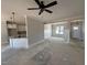 Open-concept layout with modern lighting and a partial view of the kitchen and dining areas at 47 Royal Ave, Selma, NC 27576