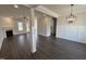 Spacious living room with wood floors, fireplace, and abundant natural light at 47 Royal Ave, Selma, NC 27576