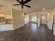 Open-concept living area with hardwood floors, recessed lighting, and abundant natural light at 47 Royal Ave, Selma, NC 27576