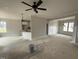Spacious living area with a ceiling fan, open layout, and access to the kitchen at 47 Royal Ave, Selma, NC 27576