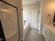 Luxurious main bathroom featuring a soaking tub, dual sinks, and walk-in shower at 47 Royal Ave, Selma, NC 27576