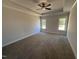Spacious main bedroom with tray ceiling, carpet floors, and natural light at 47 Royal Ave, Selma, NC 27576