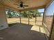Enclosed screened patio area with fan overlooking the backyard and treeline at 47 Royal Ave, Selma, NC 27576