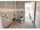Room shows fresh construction featuring plumbing fixtures and an entrance to the backyard at 47 Royal Ave, Selma, NC 27576