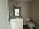 Bathroom featuring a single vanity with granite counters, white cabinets, and tile flooring at 48 Silver Ct, Smithfield, NC 27577