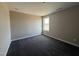 This bedroom features neutral paint, plush carpeting, and a window for natural light at 48 Silver Ct, Smithfield, NC 27577