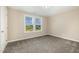 Cozy bedroom with neutral paint and large windows for natural light at 48 Silver Ct, Smithfield, NC 27577