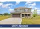 Inviting two-story home featuring a spacious driveway and attached two car garage at 48 Silver Ct, Smithfield, NC 27577