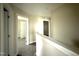 Upstairs hallway features neutral paint and carpeting and two access doors at 48 Silver Ct, Smithfield, NC 27577