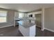 Bright kitchen with white cabinets, granite counters, island and stainless steel appliances at 48 Silver Ct, Smithfield, NC 27577
