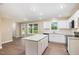 Stylish kitchen with white cabinetry, granite countertops, and stainless steel appliances at 48 Silver Ct, Smithfield, NC 27577