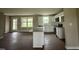 Modern kitchen featuring granite countertops, white cabinets, and stainless steel appliances at 48 Silver Ct, Smithfield, NC 27577