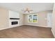 Bright living room featuring hardwood floors, fireplace, and natural light at 48 Silver Ct, Smithfield, NC 27577