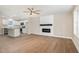 Open concept living room and kitchen with stainless steel appliances and hardwood floors at 48 Silver Ct, Smithfield, NC 27577