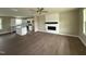 A modern open-concept living room featuring hardwood floors and an electric fireplace at 48 Silver Ct, Smithfield, NC 27577