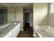 A main bathroom features a double vanity, soaking tub, and walk-in shower at 48 Silver Ct, Smithfield, NC 27577