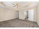 Main bedroom features carpet flooring, a ceiling fan, and a door that leads to the bathroom at 48 Silver Ct, Smithfield, NC 27577