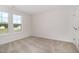 This bedroom has neutral paint, carpeting and 2 windows at 53 Barony Ln, Smithfield, NC 27577