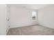 This bedroom has neutral paint, carpeting and a window at 53 Barony Ln, Smithfield, NC 27577