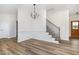 Open dining area showcases a modern chandelier and beautiful wainscoting at 53 Barony Ln, Smithfield, NC 27577