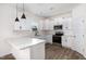 Beautiful kitchen features white cabinets, stainless steel appliances, and granite countertops at 53 Barony Ln, Smithfield, NC 27577