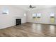 Bright living room boasts hardwood floors, fireplace and lots of natural light at 53 Barony Ln, Smithfield, NC 27577