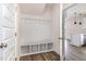 This mudroom has built-in shelving and hooks, and wood-look flooring at 53 Barony Ln, Smithfield, NC 27577