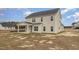 The back of the home features a covered porch and light vinyl siding at 54 Barony Ln, Smithfield, NC 27577