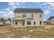 The back exterior of the home features a covered porch and light vinyl siding at 54 Barony Ln, Smithfield, NC 27577