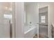 Bright bathroom featuring a shower and a window, letting in lots of light at 54 Barony Ln, Smithfield, NC 27577
