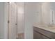 A well lit bathroom features a walk-in closet and vanity with sink at 54 Barony Ln, Smithfield, NC 27577