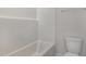 Bathroom featuring a toilet and bright shower-tub at 54 Barony Ln, Smithfield, NC 27577